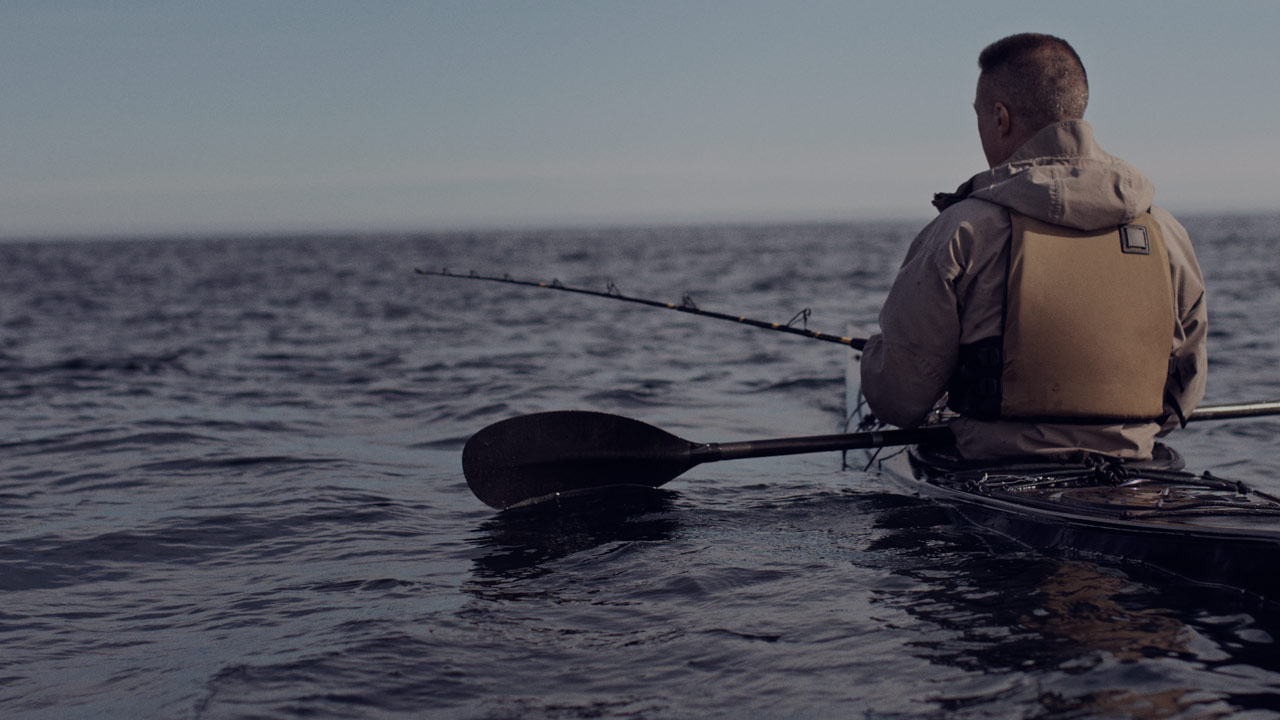 man in kayak large overlay